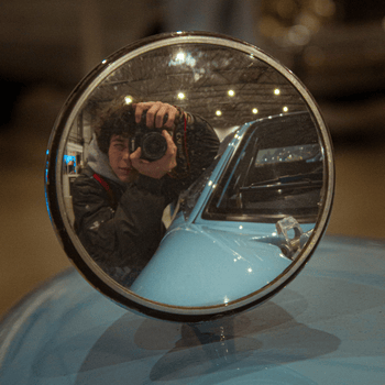 Mz reflection in the mirror of an old Ford GT40